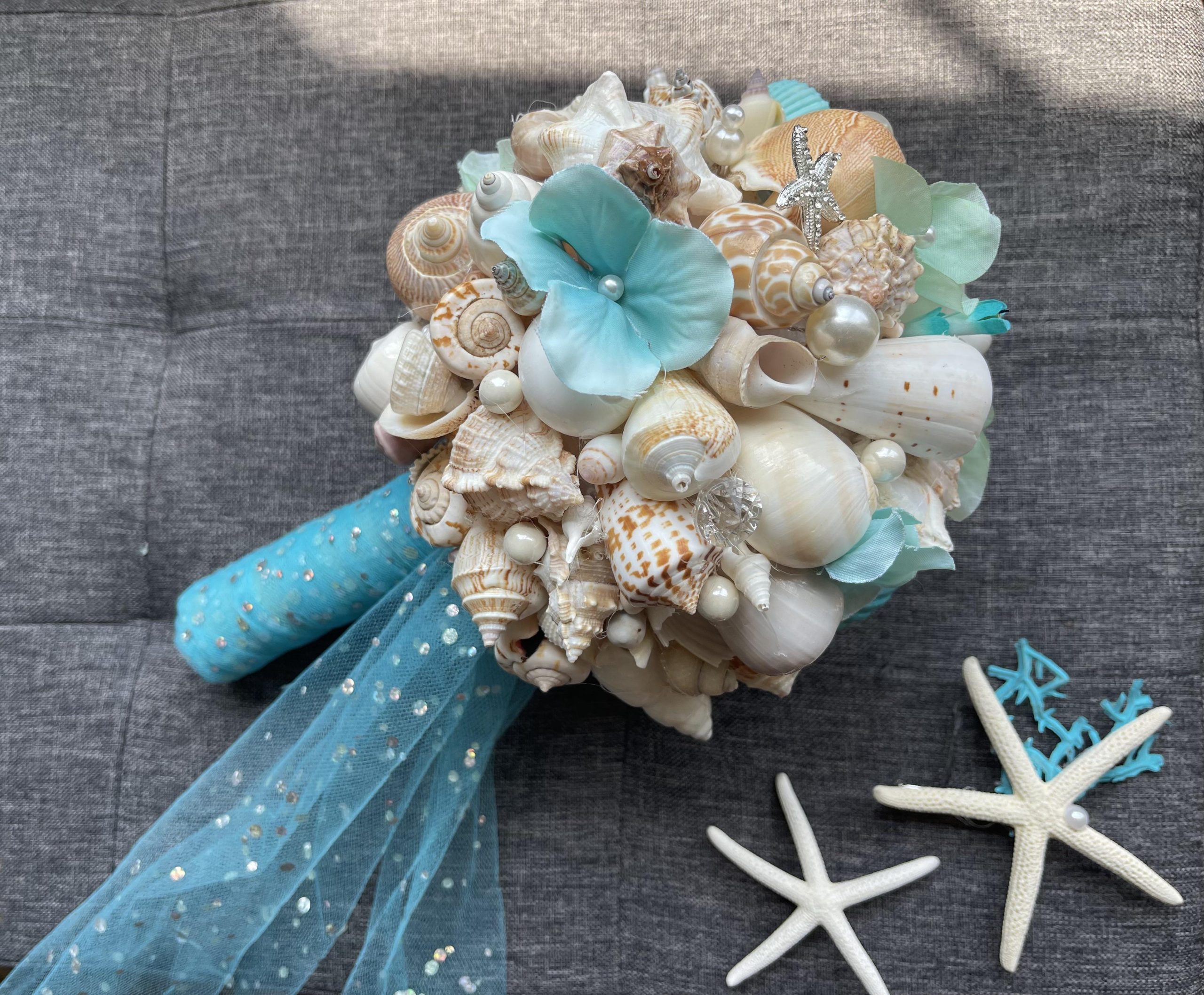 Wedding Flowers And Seashells For A Beach Themed Wedding